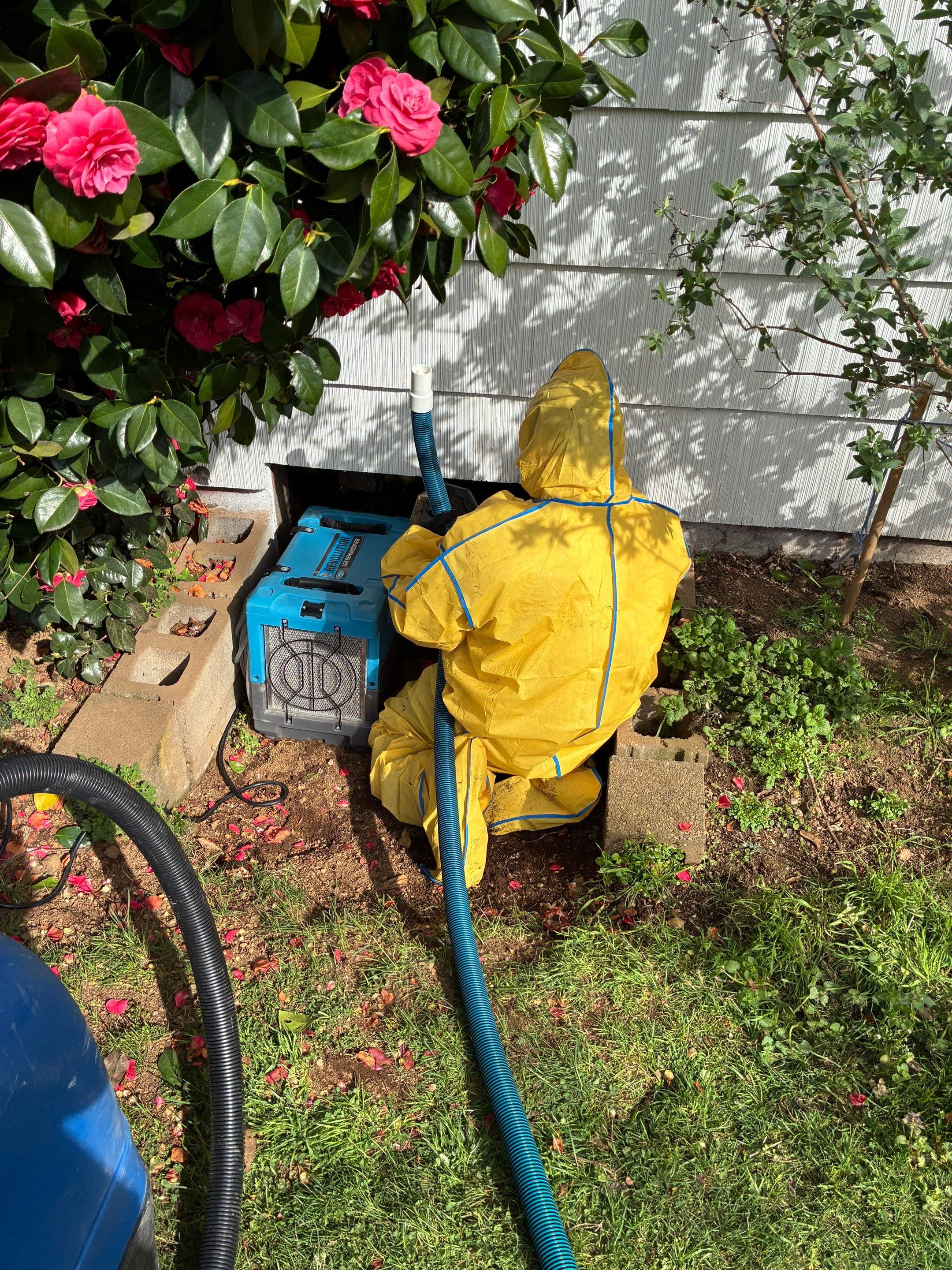 ProCoat restoration technician working outdoors in protective equipment